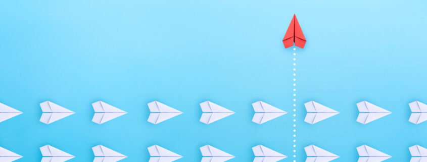 Group Of White Paper Plane In One Direction And One Red Paper Pl