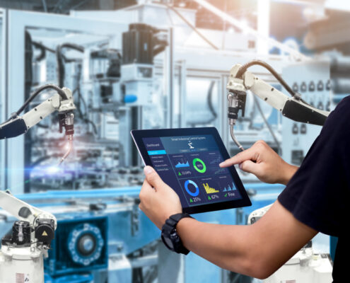 Smart Industry Control Concept.hands Holding Tablet On Blurred A